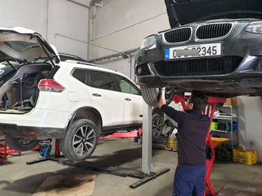 BMW 320i on workshop ramp
